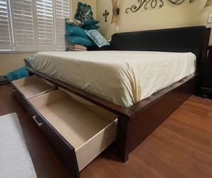 King Size solid wood bed frame by Ashley Furniture
