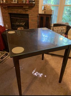 Moving sale dinning table with glass top and 2 chairs