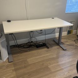 White 60” W x 28” D adjustable desk