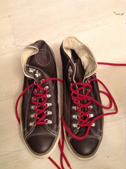 Brown leather high top converse