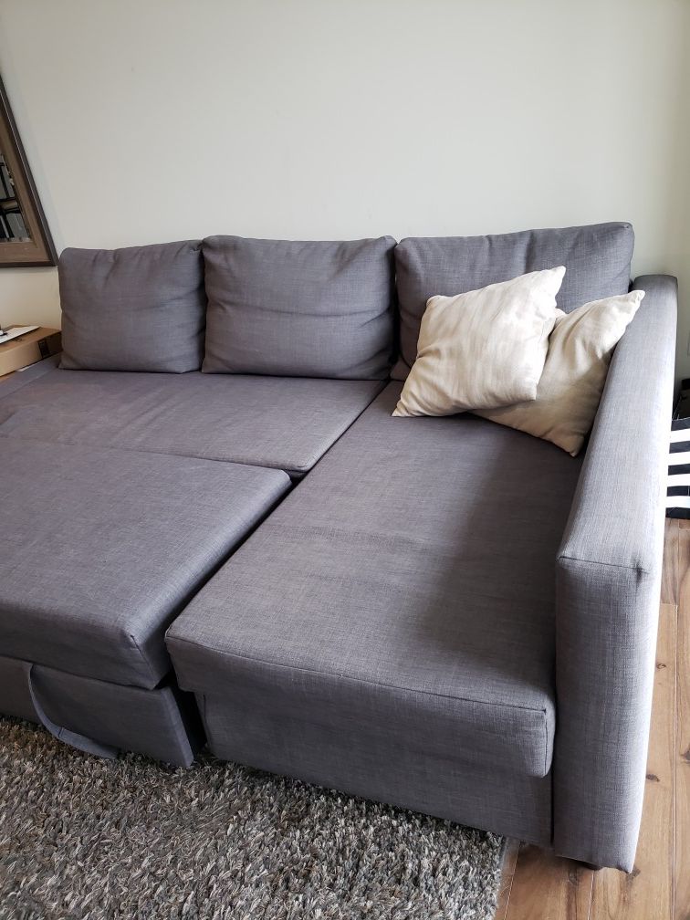 Grey sectional couch w/double bed option