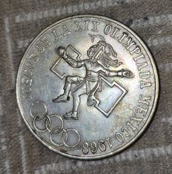 +4                    This is a 1968 Mexican 25 Pesos silver coin