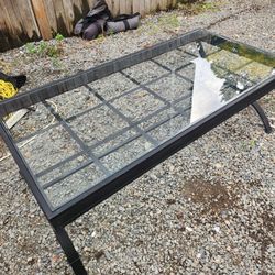 Outdoor patio coffee table metal and glass top good condition

Just a good solid metal glass topped outdoor patio coffee table 
