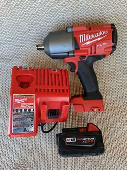 Milwaukee High Torque impact m18 Fuel + m18/m12 charger  + m18  battery