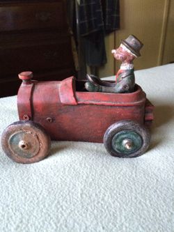 Cast iron car4" hi 6" with driver. Removable driver #348 . Can't find any Mark. Great shape