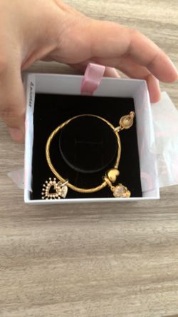 Gold plated Pandora bracelet with charms