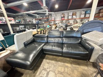 Black leather sofa with chaise