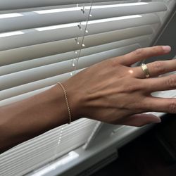 750 Stamped 18k Gold Thin rope bracelet. 