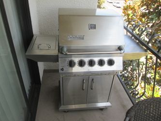 Ducane 4-burner stainless steel gas grill and a side burner and rotisserie system