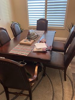 Classic solid wood table, well-maintained.