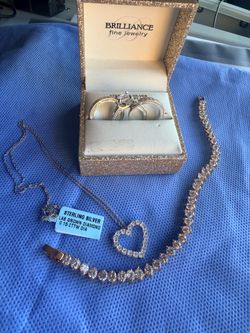 Sterling Silver ring set and necklace. Rose gold tone tennis bracelet.