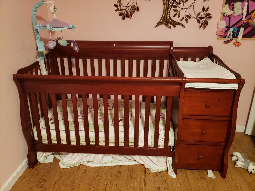 Crib with changing table and bedding set and matress