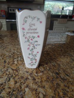 Vase with Love saying on each side of the vase.
