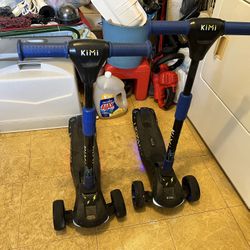 Pair Of Kimi Kids Electric Scooters 