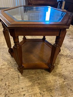 Vintage end table with glass top and cane shelf