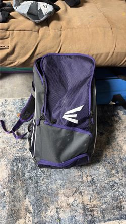 Softball bag with softballs and softball helmet