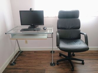 Desk, chair, monitor and keyboard