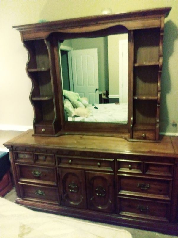 Solid oak dresser that has 9 drawers as well as mirror w/shelves and 2
