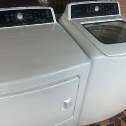 Frigidaire Washer Dryer Set. Stainless steel tub with glass washer lid.