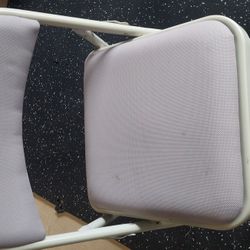 Foldable chairs with padded seats and backs.