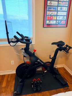 Peloton Bike includes weights, shoes, mat