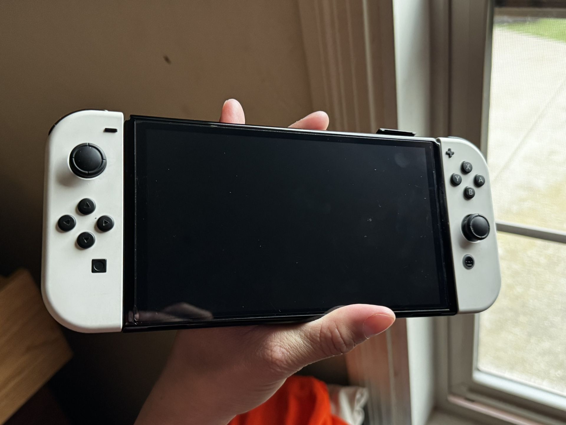 Nintendo Switch OLED for Sale Only Used Twice. Basically New, Comes With Games As Well As Charger And Tv Dock For The Console. As Well As Evee Joy Con