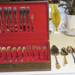 54 PIECE EMBOSSED STAINLESS STEEL SILVERWARE SET W/SERVING PIECES AND WOODEN CHEST