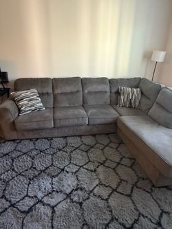 Couch, Rug, and black bar