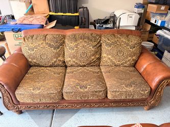 Leather and Fabric Loveseat with Carved Wood Frame