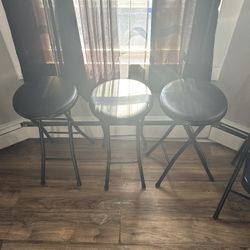3 Black metal stools 