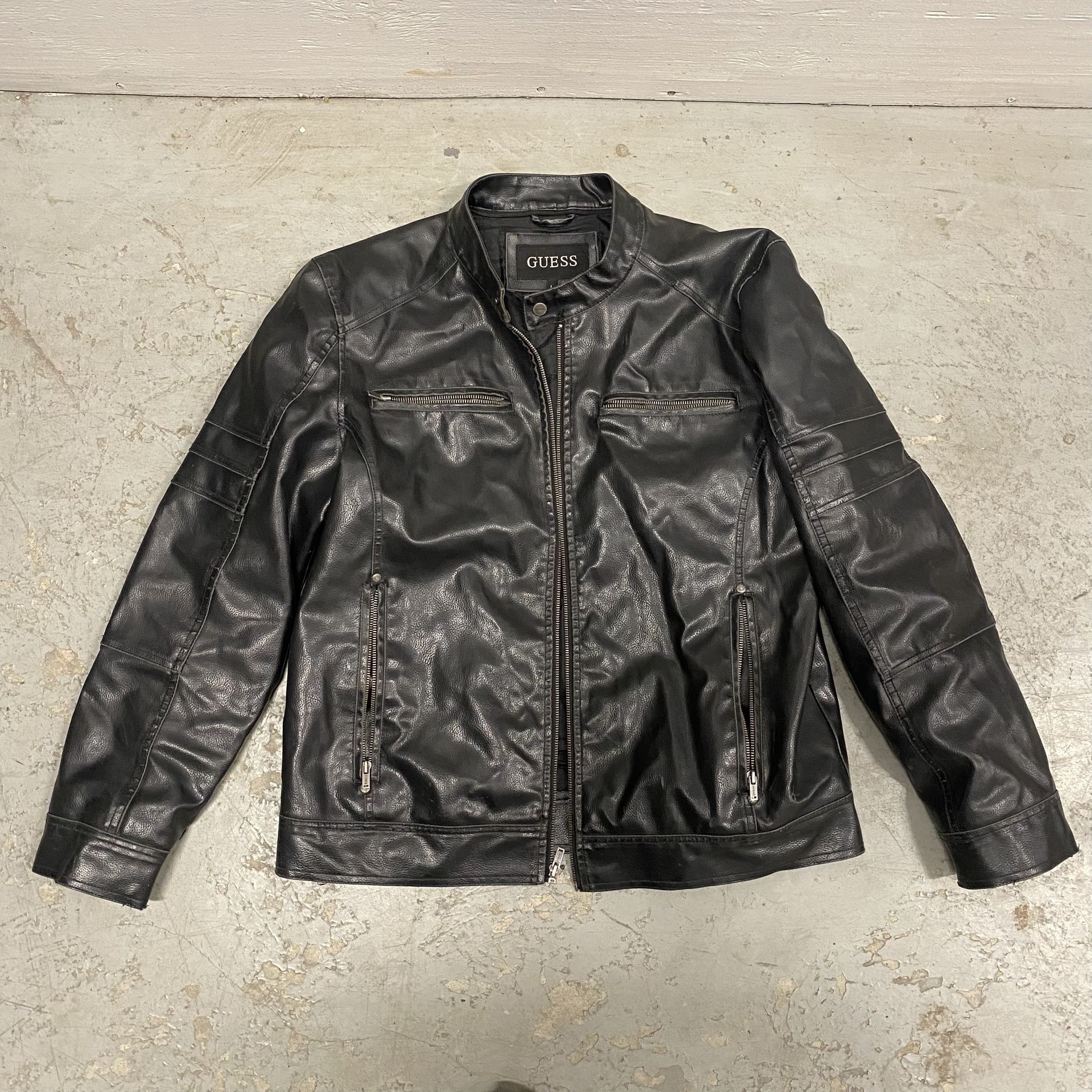 Black Vintage 90’s GUESS Faux Leather Banded Neck Jacket Size Men’s Large  Good pre-owned condition. There is a small separation in the seam in the ba