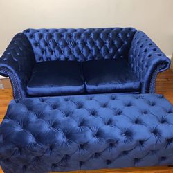 Two Beautiful Blue Couches With A Ottoman 