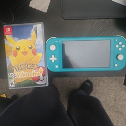 Teal Nintendo switch lite with Pokemon game