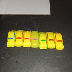 Here are a lot of 7 Yellow small Volkswagen Beetle made by Pez in Italy.