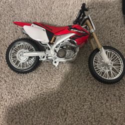 Two Toy Dirtbikes