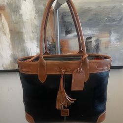 Dooney & Bourke Black Saffiano Tassel Bucket Tote Bag Black with a Tan Trim 