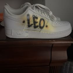 The product in the image is a pair of Nike Air Force’s brand New never worn before with “Leo” airbrushed on it Size 11i