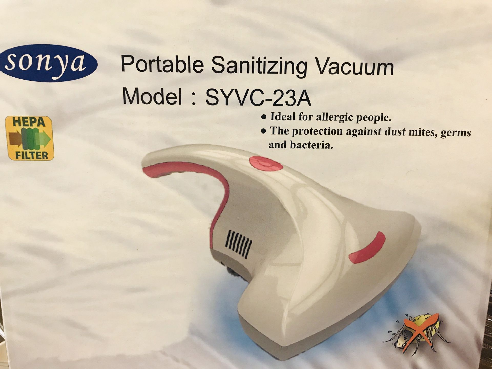 Portable sanitizing vacuum