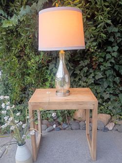 Natural Wood Table with Beautiful Modern Lamp