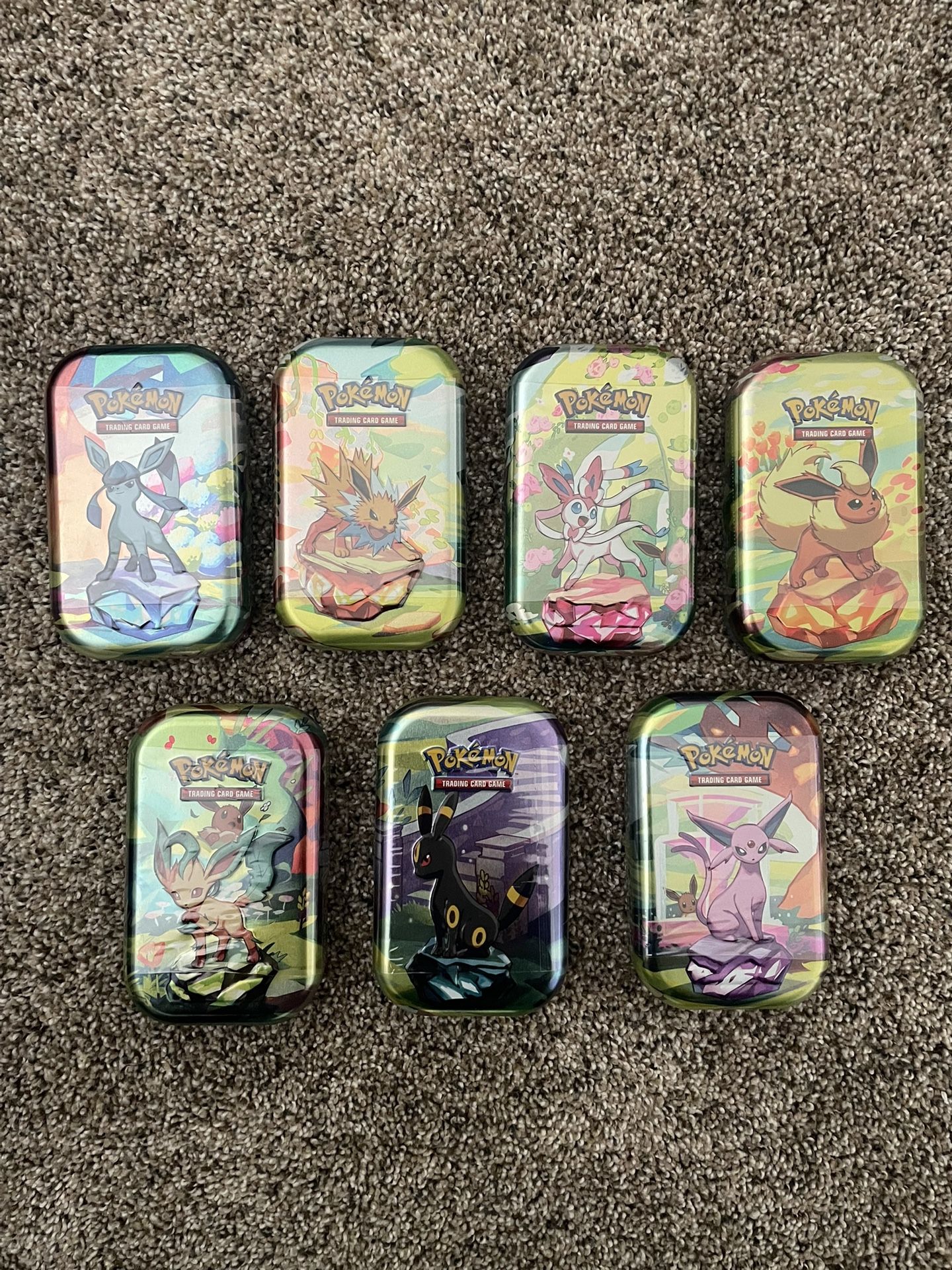 Pokemon Prismatic Tins Lot 7 (**missing Vaporeon**)