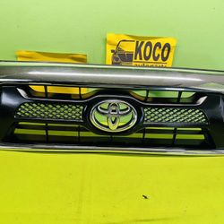 2013 - 2015 Toyota Tacoma Front Bumper Grille Radiator Grill Chrome OEM USED