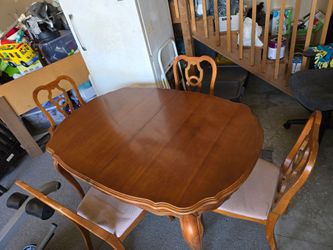 Solid wood table and chairs with 3 extensions.
