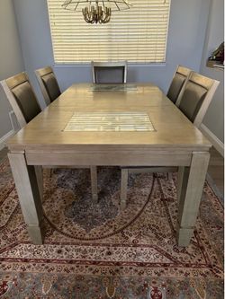 Solid wood dining table and chairs.