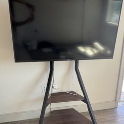 Vizio 50” TV + height adjustment rolling TV stand