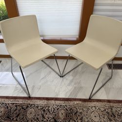 2 Ivory pleather chairs