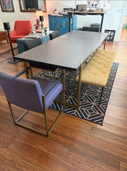 Oscura designer dining table with built in leaf and chairs and bench