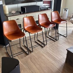 CB2 LEATHER SADDLE STOOLS