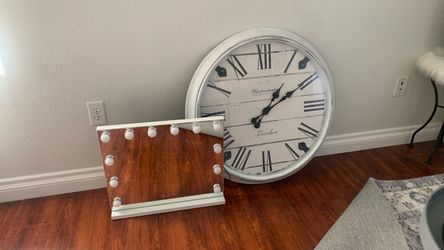 Mirror with a white wall clock