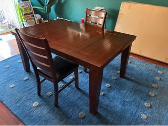 Wood dining room table 64” plus extension and 2 chairs