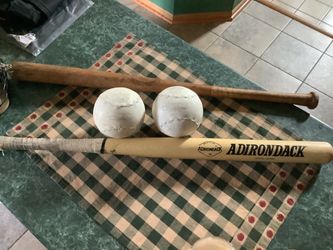 Softball 16” package including Adirondack wooden softball bat 34” like new, and two 16” softballs by Debeer Clincher, and one other wooden softball ba